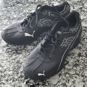 Black Puma athletic shoes
